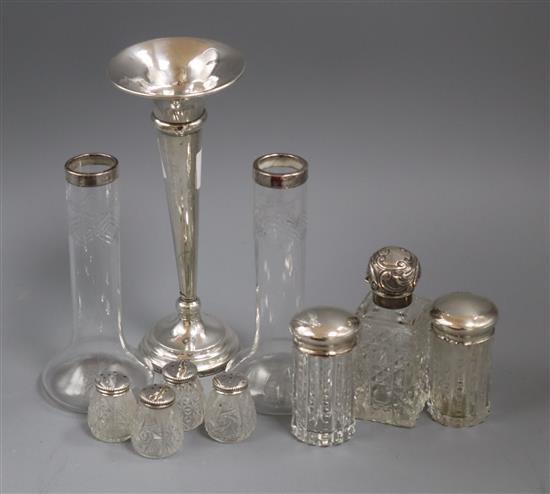 A silver trumpet vase, a silver mounted glass scent bottle and other items.